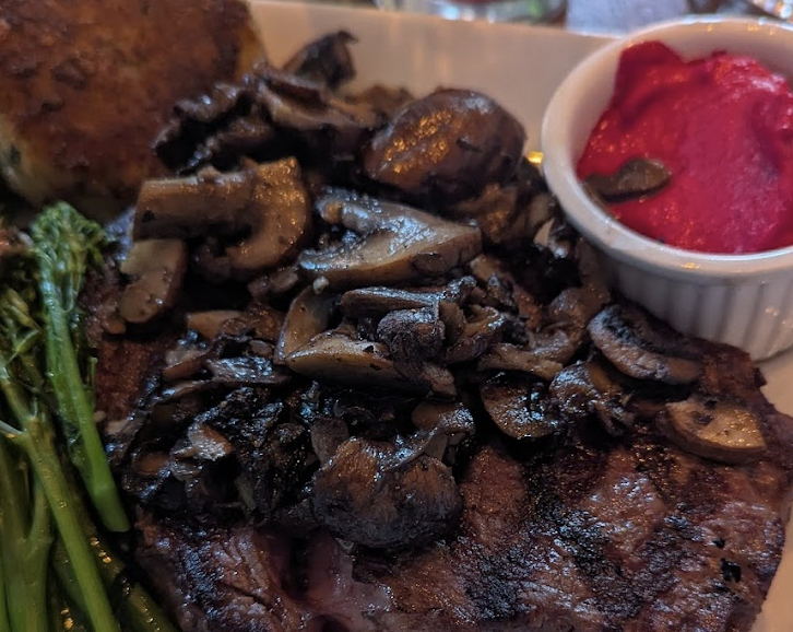Cafe Pasqual's signature dishes Grilled  Ribeye Au PoivreTwo Oaxacan TamalesPan Seared Arctic Char